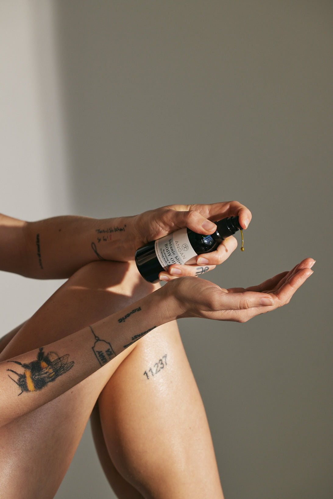 ANGAN autumn skincare ritual — body oil and salt scrub flatlay, Iceland