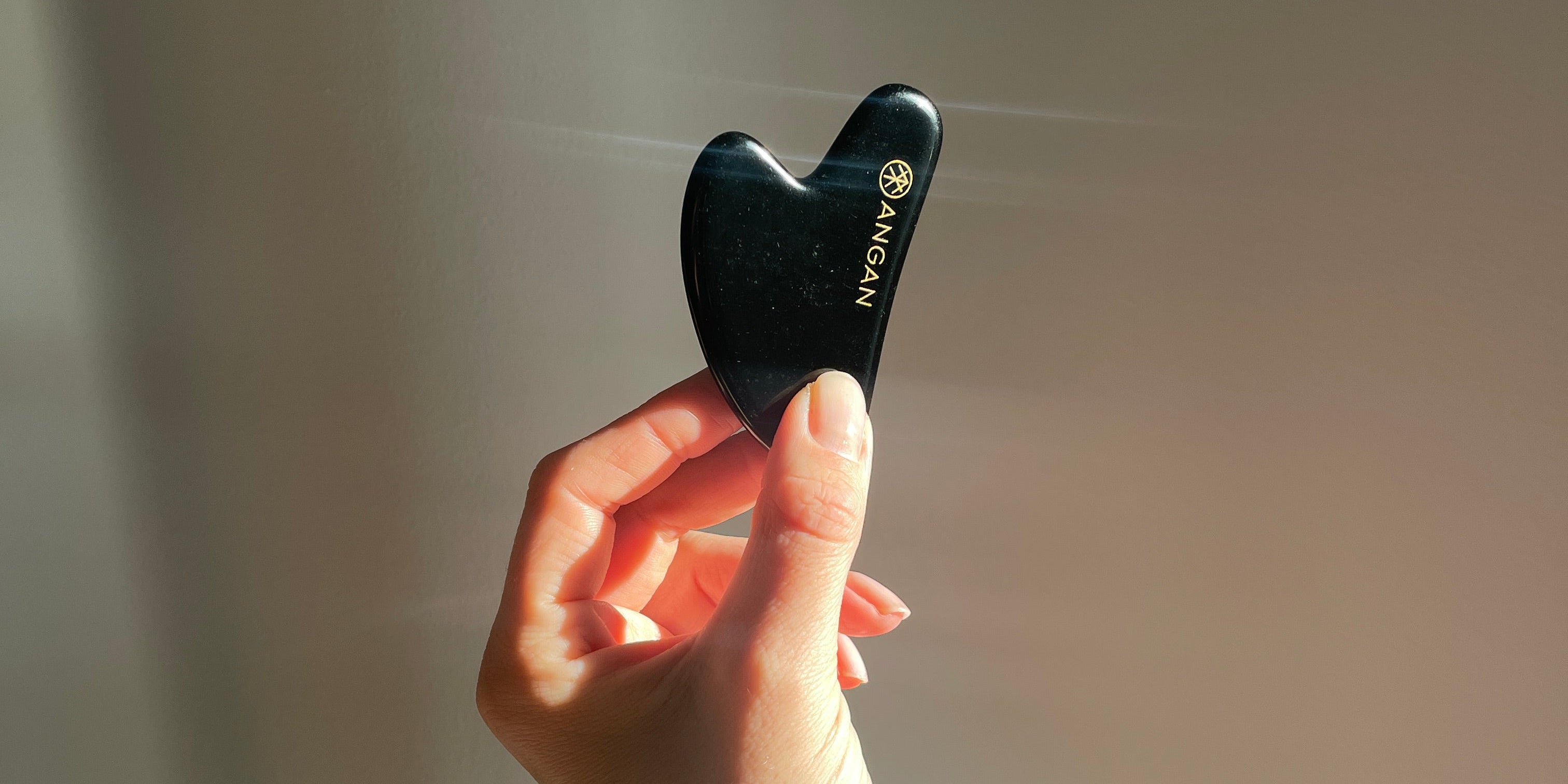 ANGAN Obsidian Gua Sha — ancient facial massage technique for sculpted, glowing skin