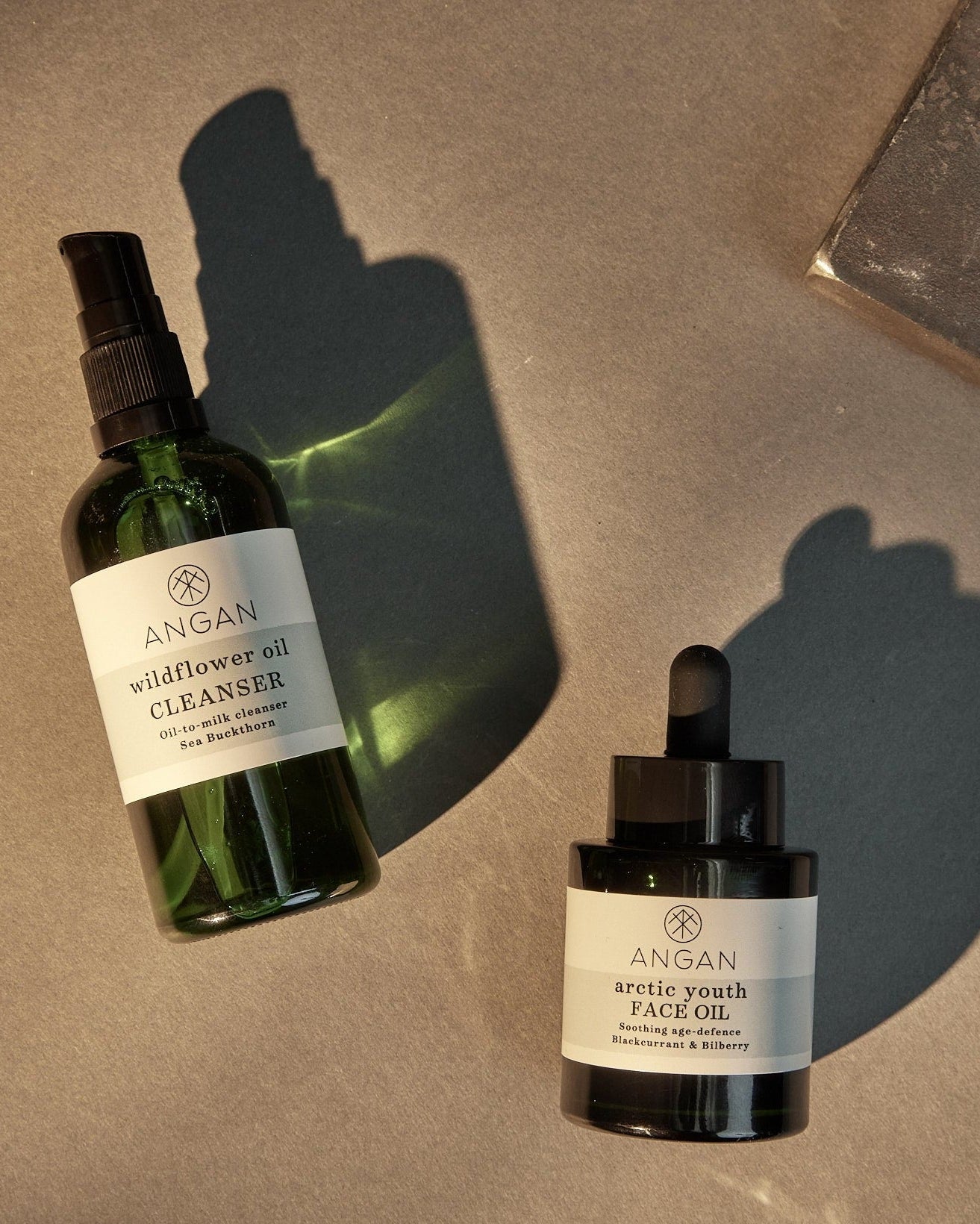 ANGAN Icelandic Glow Duo — face oil and cleanser lifestyle shot