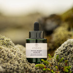 ANGAN Moon Magic Bio-Retinol Serum — bottle on mossy Icelandic landscape
