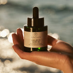 ANGAN Sun Glow Serum — product shot with Icelandic botanicals