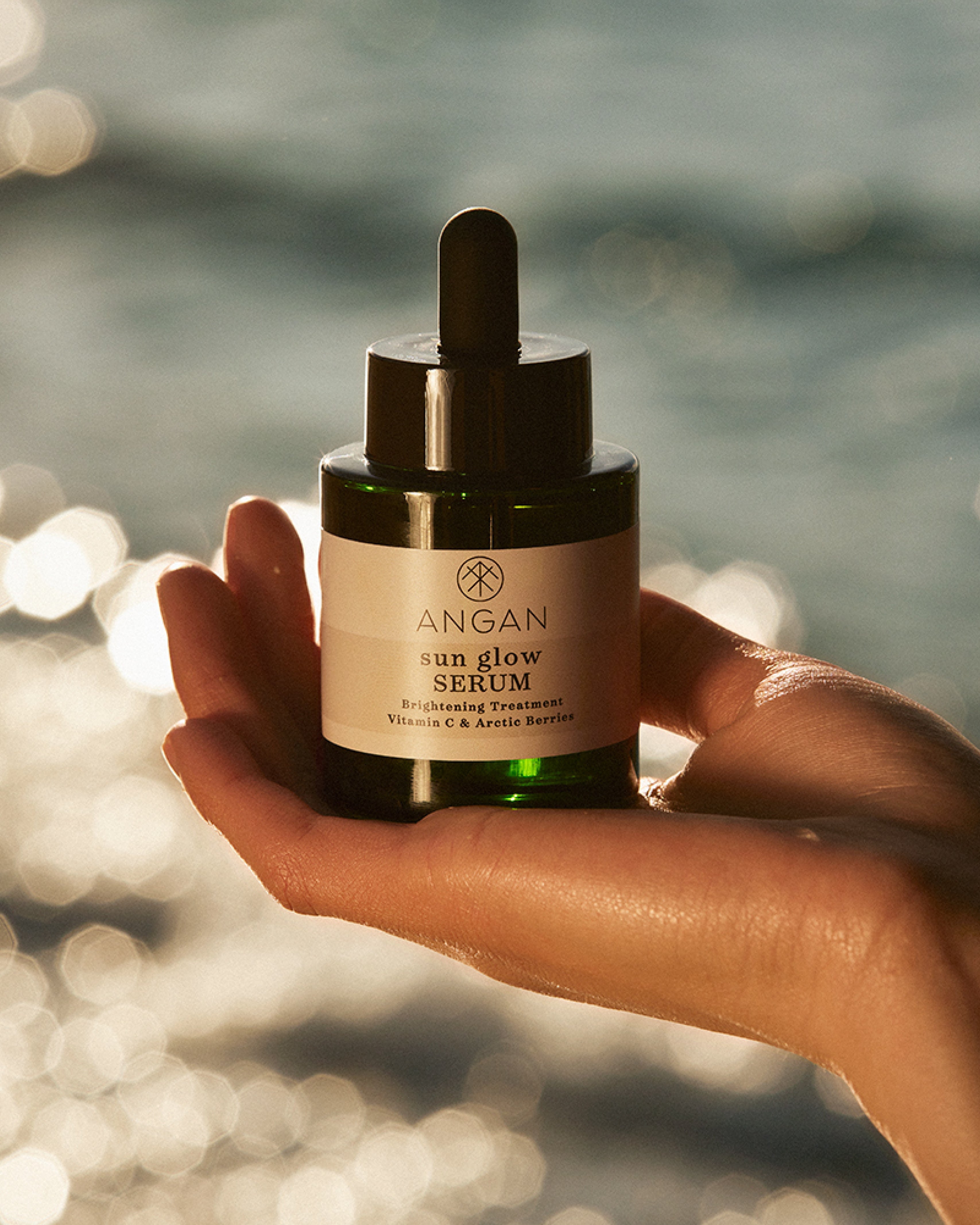 ANGAN Sun Glow Serum — product shot with Icelandic botanicals