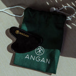 ANGAN Obsidian Gua Sha — outdoors in Icelandic sunshine
