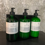 ANGAN Westfjords 3-bottle wall display — installed in spa or retail