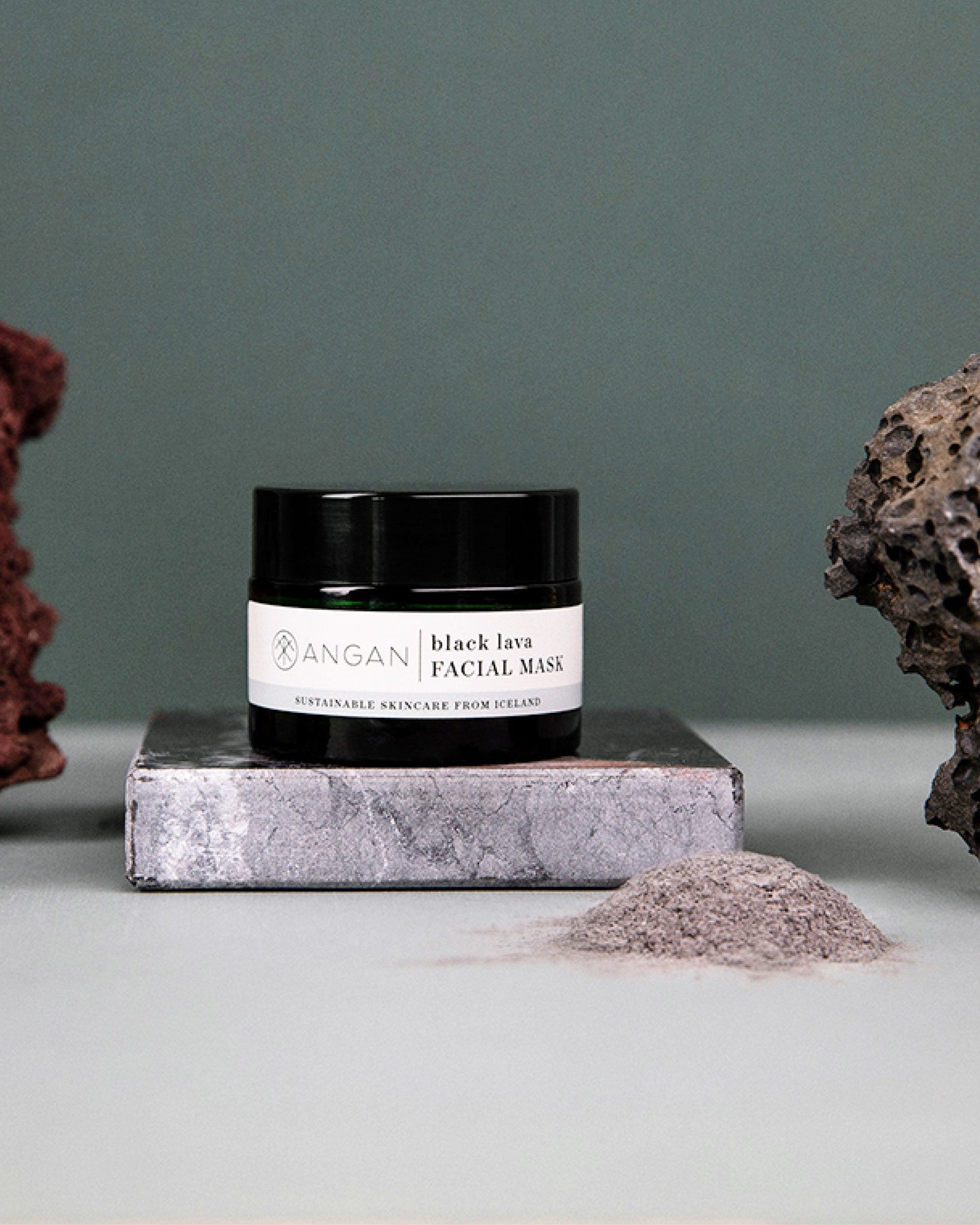 ANGAN Black Lava Face Mask — multiple jars on Icelandic landscape