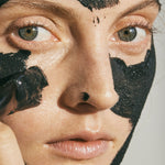 ANGAN Black Lava Face Mask — open jar showing volcanic clay texture